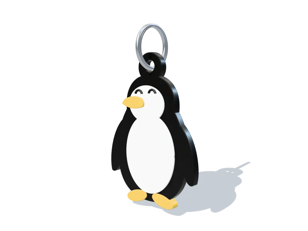 Llavero de pingüino en negro, blanco y amarillo con argolla